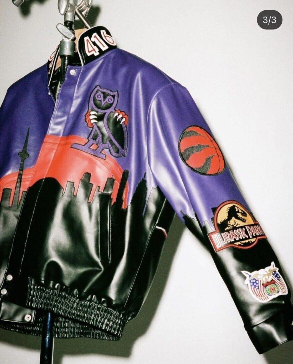 Jurassic Park Varsity Jacket - Black and yellow varsity jacket with Jurassic Park logo.