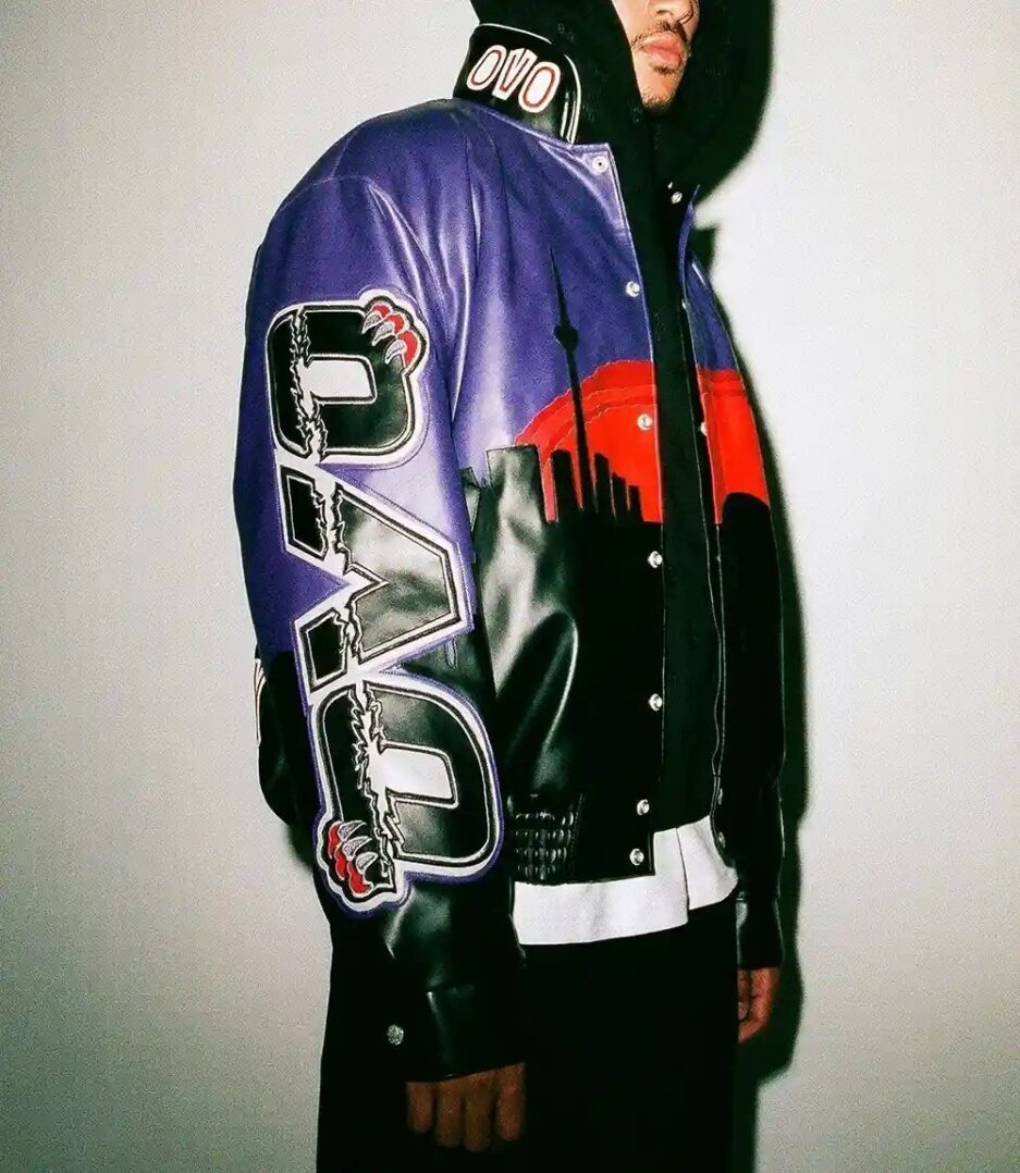 Jurassic Park Varsity Jacket - Black and yellow varsity jacket with Jurassic Park logo.