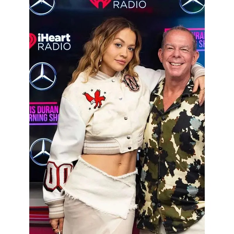 elvis-duran-morning-show-rita-ora-white-varsity-jacket